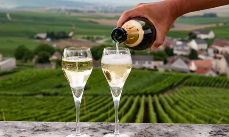 Glass of champagne being poured at a wine event